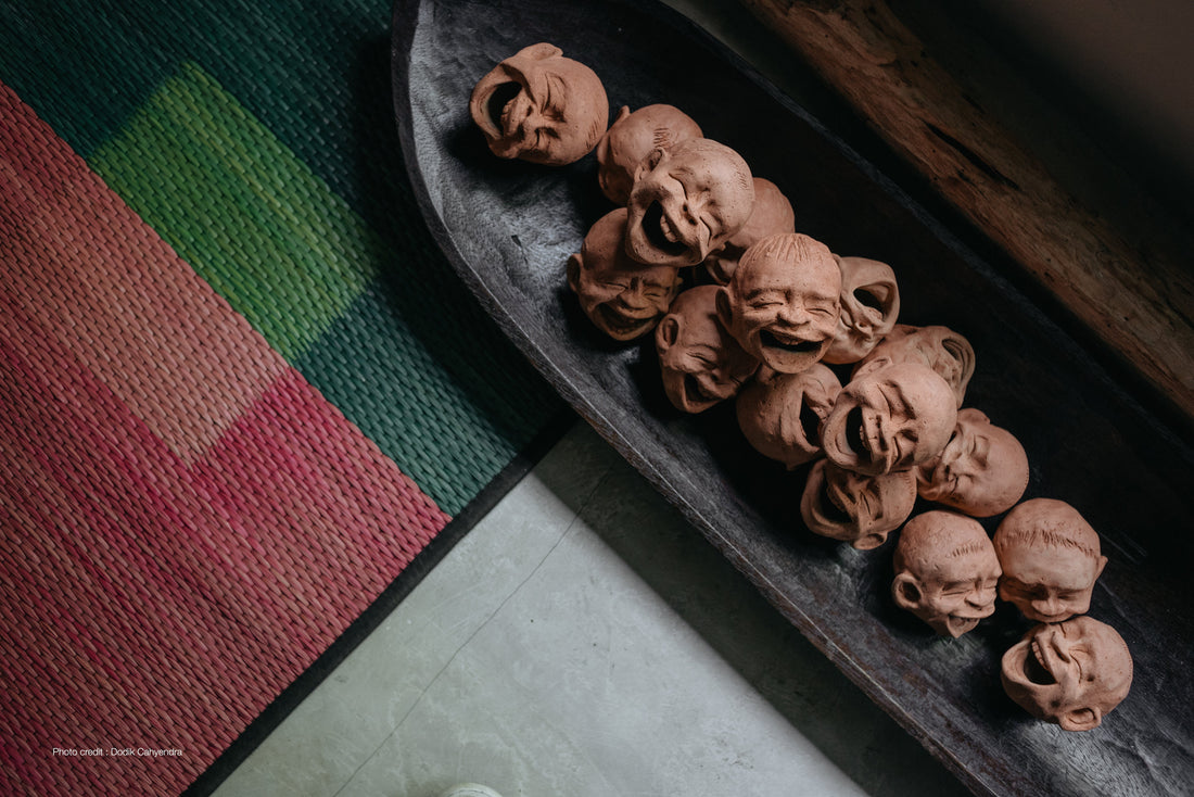 contemporary terracotta sculpture in joyful characters