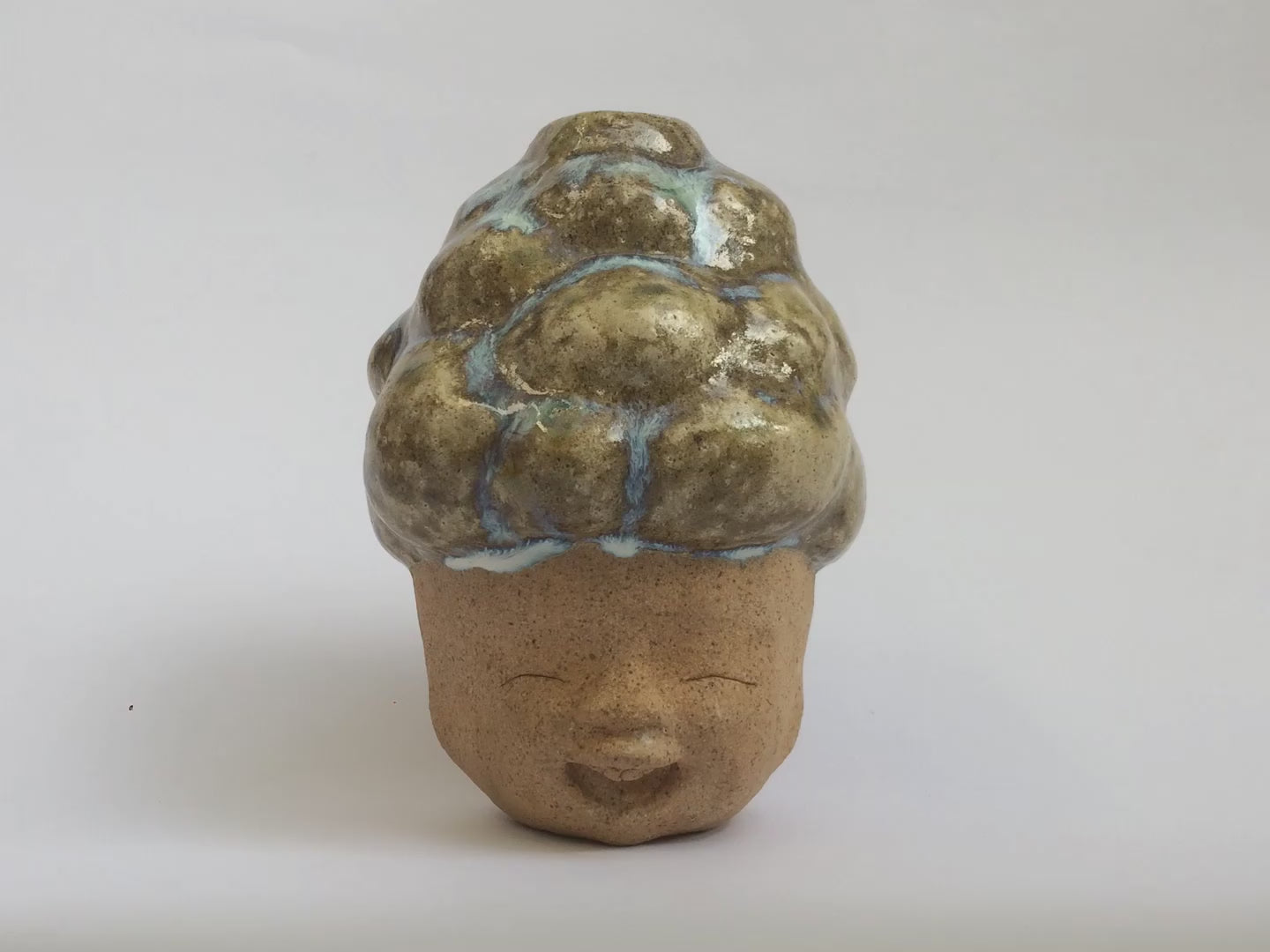 Brown figurative ceramic sculpture with brown glazed 360 video.