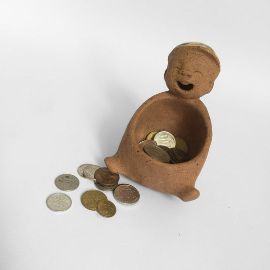 Brown unglazed ceramic object with speckle glazed accent on top.