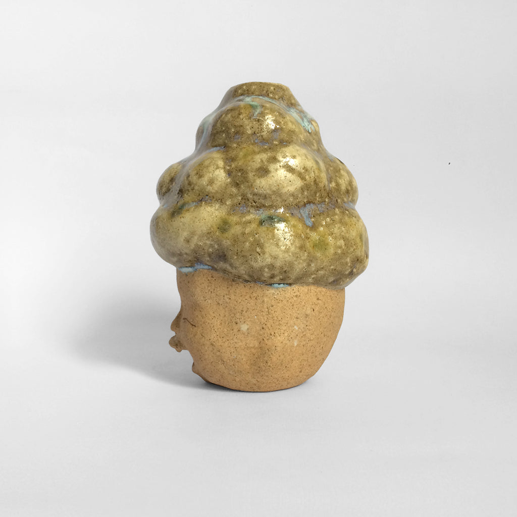 Brown figurative ceramic sculpture with brown glazed head facing left.